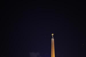 The enchanting night view of a magnificent monument illuminated by a brilliant star photo