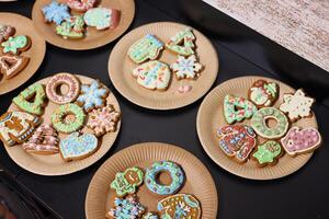 Beautifully Festively Decorated Holiday Cookies Served on Colorful Plates for Enjoyment photo