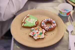 A Beautifully Decorated Selection of Holiday Cookies Artfully Displayed on a Decorative Plate photo