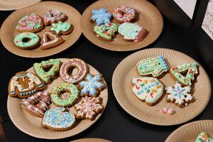 Gorgeous and Beautifully Decorated Holiday Cookies Arranged on Plates for the Celebration photo