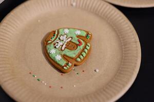 A Delicious and Festively Decorated Gingerbread Cookie in the Charming Shape of a Sweater photo