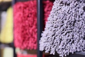 A Colorful and EyeCatching Display of Various Textured Fabrics Presented on Shelves photo