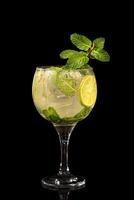 Mojito, classic Cuban drink with rum, ice and mint leaves photo