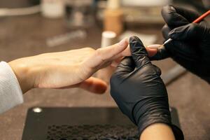 View of the process of a manicure being performed by a master photo