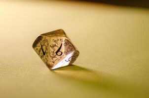 close-up view of a transparent die for board games and role-playing games photo