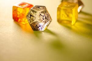 close-up view of three dice of different shapes for board games and role-playing games photo