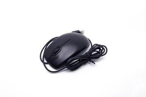 A black computer mouse with a cord on a white background photo