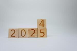 Wooden Blocks Representing Year Transition From 2024 to 2025 photo