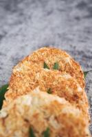 Indonesian Traditional Coconut Cake called Sagon on Banana Leaf with Rustic Background Setting photo