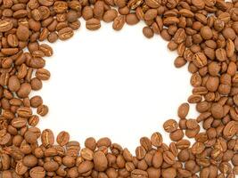 Top view of fresh aromatic roasted coffee beans background with copy space for text photo