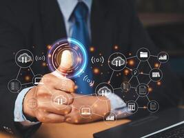 A Businessman scan fingerprint biometric identity to access personal data photo