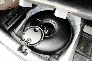 LPG or Propane gas container in vehicle trunk , Car alternative energy concept photo