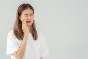 Asian woman feel toothache from gingivitis, female suffer tooth, decay problems, dental care. sensitive tooth, decay problem, bad breath, Gingival Recession, Oral Hygiene instruction, tooth extraction photo