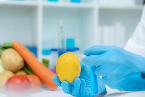 Scientist check chemical food residues in laboratory. Control experts inspect quality of fruits, vegetables. lab, hazards, ROHs, find prohibited substances, contaminate, Microscope, Microbiologist photo