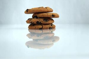 Chocolate chip cookies with chocolate chips on a white light background with space for copyspace text photo