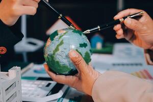 Carbon offset price report CO2 emission. Future growth Net zero waste in ESG ethical SME office protect climate change global warming social issues project. Group of asia people Eco friendly SDGs plan photo