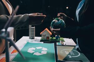 Carbon offset price report CO2 emission. Future growth Net zero waste in ESG ethical SME office protect climate change global warming social issues project. Group of asia people Eco friendly SDGs plan photo