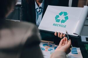 Carbon offset price report CO2 emission. Future growth Net zero waste in ESG ethical SME office protect climate change global warming social issues project. Group of asia people Eco friendly SDGs plan photo