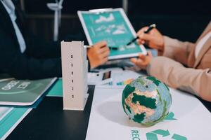 Carbon offset price report CO2 emission. Future growth Net zero waste in ESG ethical SME office protect climate change global warming social issues project. Group of asia people Eco friendly SDGs plan photo