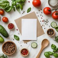 Fresh ingredients with blank card on marble surface tomatoes, cucumber, basil, and spices photo
