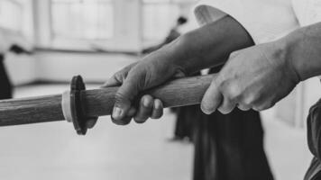People practicing aikido in a dojo background. photo