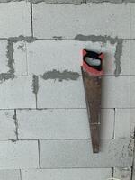 mannual saw on the floor in a building construction site background photo