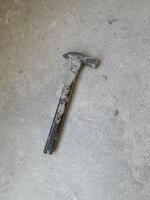 a hammer on the concrete floor background photo