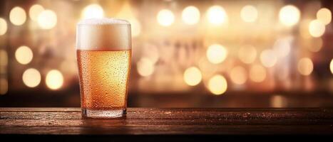 Frosty beer mug with condensation droplets, showcasing refreshing drink against blurred background of warm lights. Perfect for celebrations and gatherings photo