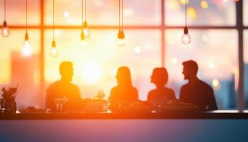 Sharing meal with family members during sunset creates warm and inviting atmosphere. blurred silhouettes against glowing backdrop enhance emotional connection photo