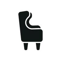 Wing chair icon showcases a classic and comfortable style, ideal for representing traditional interiors, study rooms, or reading nooks vector