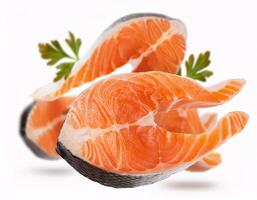 Pieces of fresh raw salmon floating in the air, isolated on white background photo