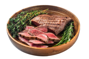 Grilled sliced Skirt Steak on a plate with herbs. Gray background. Top view png