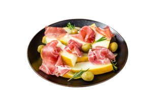 Prosciutto ham and melon salad in a plate. Black background. Top view png