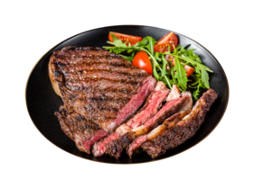 Barbecue grilled and sliced wagyu Rib Eye beef meat steak on a plate. Dark background. Top view png