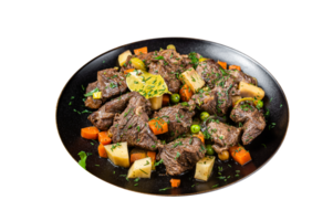 Beef meat stew, braised beef meat with vegetables in a plate. Wooden background. Top view png
