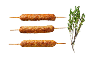 Lula kebab. Shish kebab on a stick, from ground beef meat. Black background. Top view png