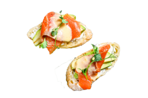 Healthy sandwich with avocado and salmon. Spinach and arugula salad. Black background. Top view png