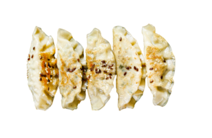 Pork Potstickers on rustic black table. Dim sum on a plate. Top view. png