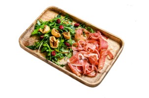 Salad with Serrano jamon, ham, rucola and fig. Antipasto. Gray background, top view, space for text png