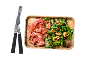 Salad with Serrano jamon, ham, rucola and fig. Antipasto. Gray background, top view. png