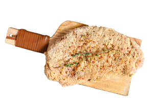 Raw chicken schnitzel in breadcrumbs. Gray background. Top view png