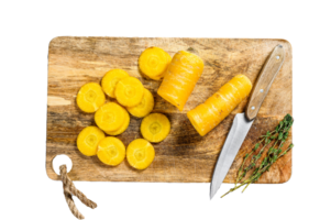 Sliced fresh Yellow carrots without tops, the concept of cooking vegetables. Gray background. Top view png