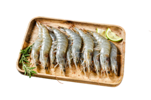 Whole fresh raw langoustine prawns, shrimps on a wooden tray. Black background. Top view png