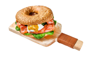 Bagel with salted salmon, cream cheese, avocado and egg. Gray background. Top view png