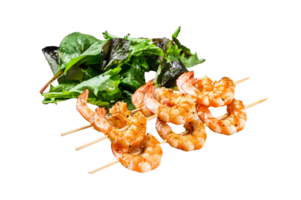 roasted shrimps, prawns on skewers with spinach salad. Gray background. Top view png