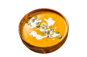 Pumpkin soup with cream, seeds and fresh basil in rustic wooden bowl. gray background. Top view png