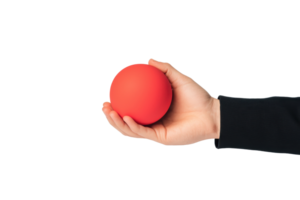 A hand holds a vibrant red ball, showcasing its smooth surface and round shape. png