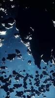 immense cluster of dangerous space rocks in the midst of a cosmic haze, vertical video