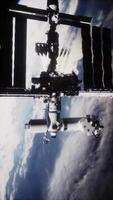 ISS orbits Earth with solar panels extended in low orbit video