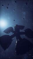 A spaceship navigating an asteroid field in space video